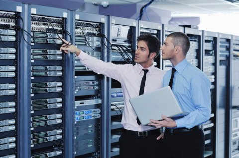 IT professionals checking servers in a data center