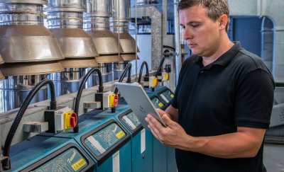 Worker doing maintenance checking on tablet