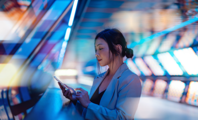 Female person checking her mobile phone.