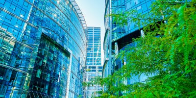 Modern office buildings and trees.
