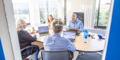Planon employees in a meeting room