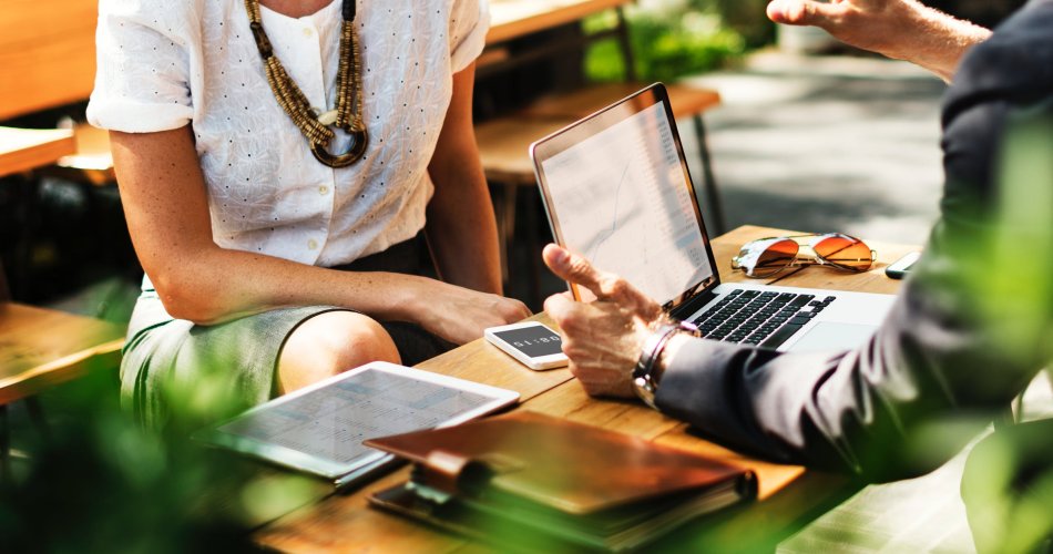 Employees discussing in sustainable workspace